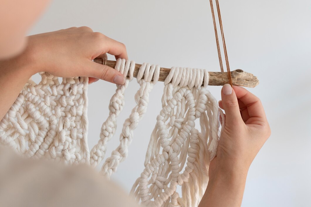 Person making a macrame piece